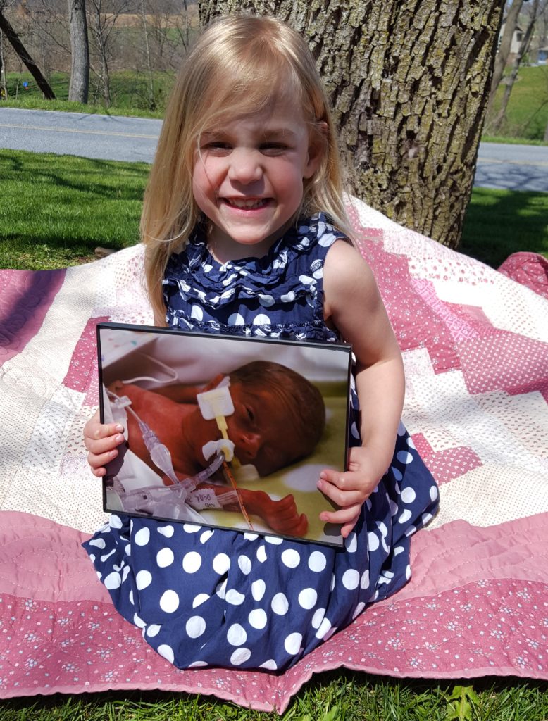 Lydia with her newborn photo